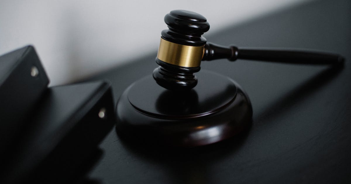 Legal documents and contracts on a desk representing indemnity agreements